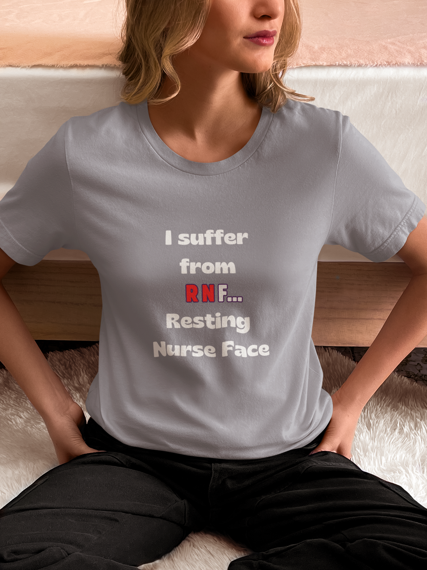 a light grey short sleeve t shirt that reads " I suffer from RNF... Resting Nurse face"